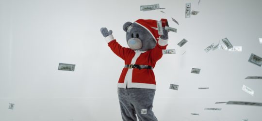 bear throwing paper money in the air