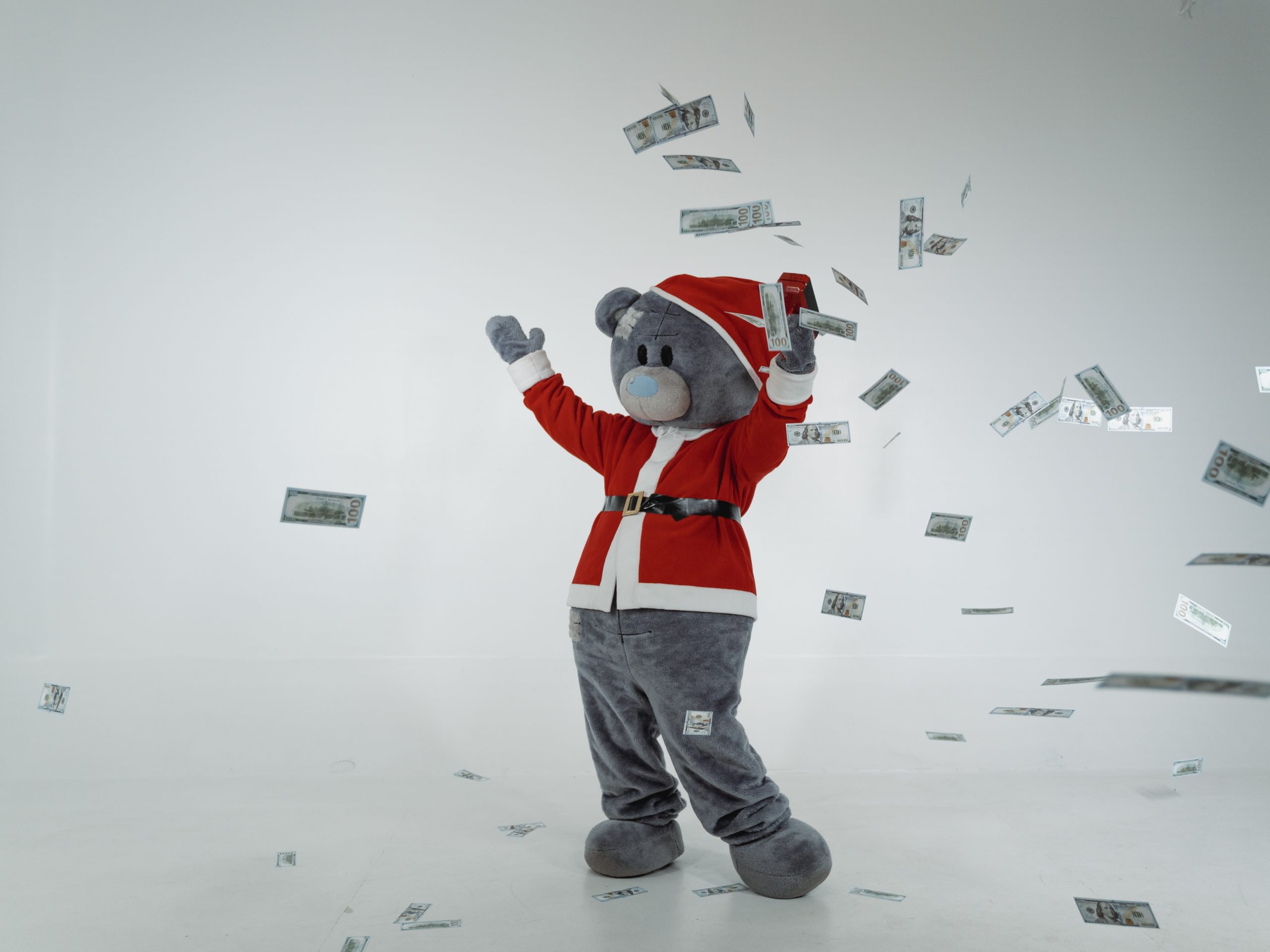 bear throwing paper money in the air