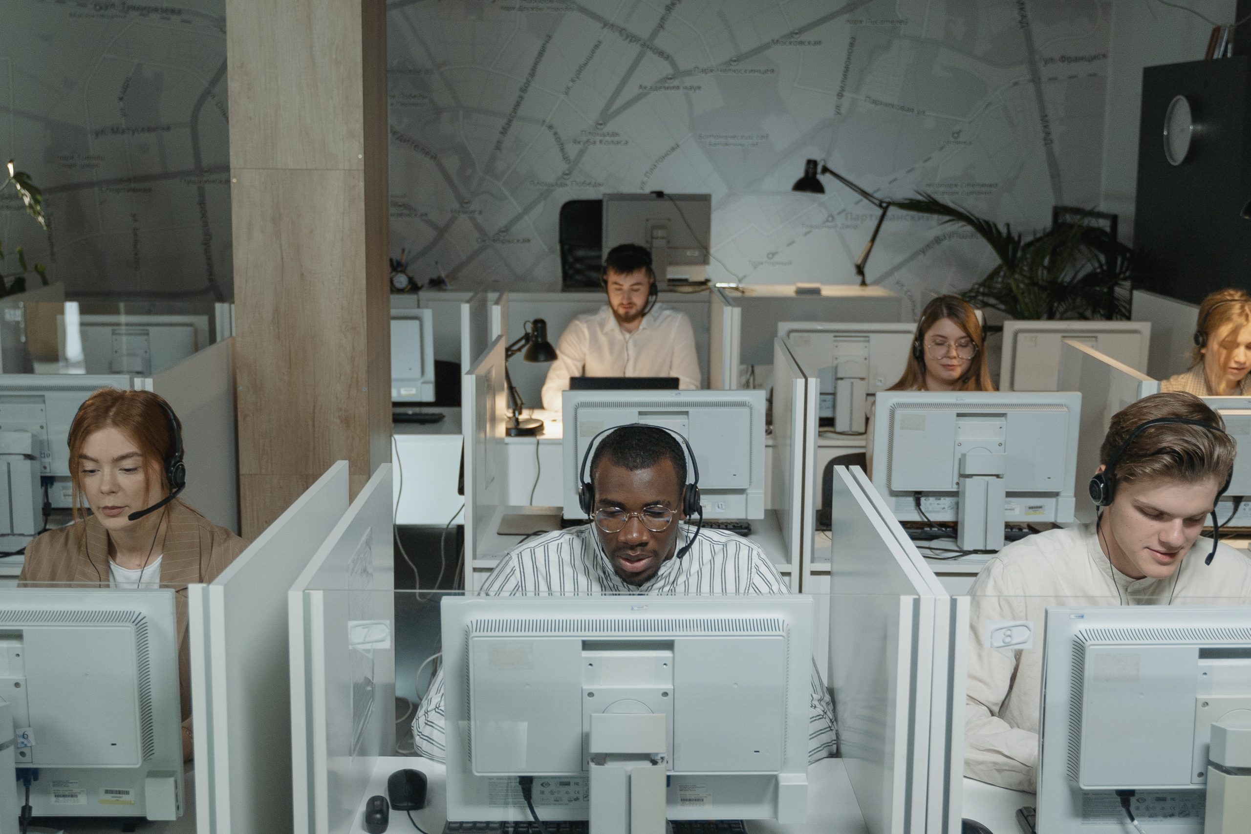 row of people working on computers