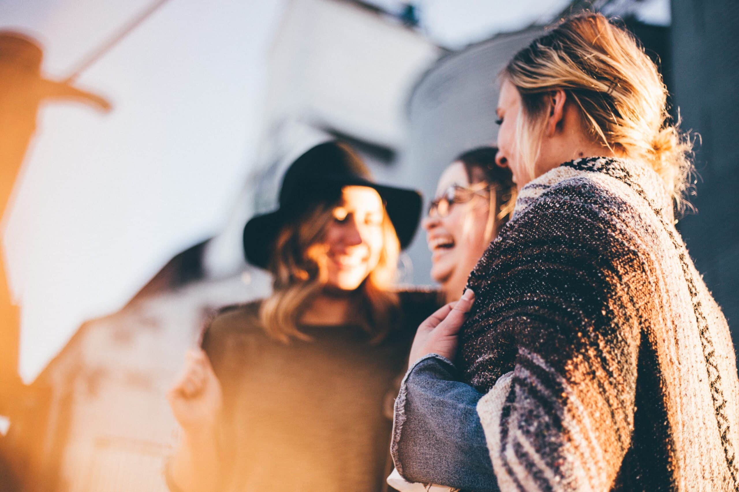 three women laughing together